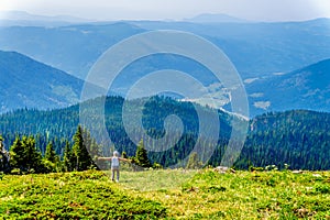 A senior woman on the hillside of Tod Mountain in BC Canada