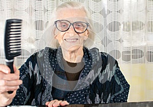 Senior woman holding a comb