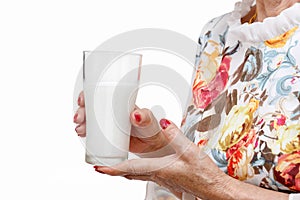 Senior woman holding a glass of milk