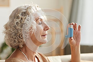 Senior Woman Holding Inhaler