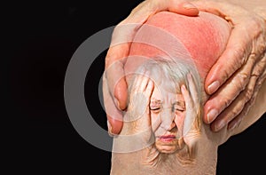 Senior woman holding the knee with pain