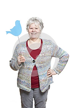 Senior woman holding a social media sign smiling
