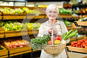 Senior woman holding wicker basket