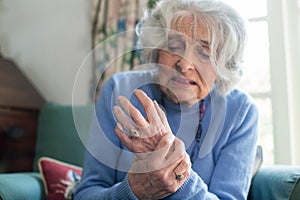 Senior Woman At Home Suffering With Arthritis photo