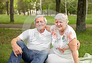 Senior woman hugging her partner. Senior couple having fun together