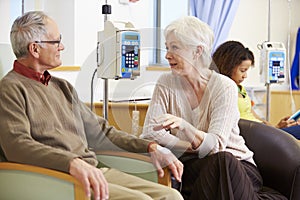 Senior Woman With Husband During Chemotherapy Treatment