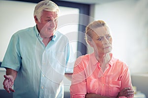 Senior woman ignoring a senior man while argument