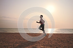 Senior woman jogging on sea beach