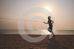 Senior woman jogging on sea beach