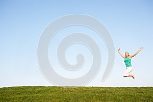 Senior woman jumping in air