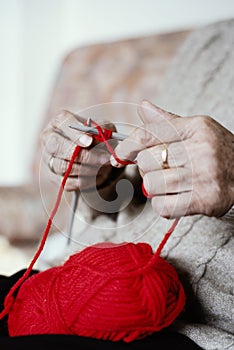 Senior woman knitting a piece