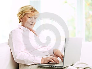 Senior woman with laptop.