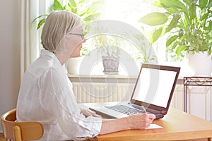 Senior woman laptop blank screen