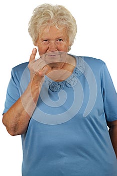Senior woman with lifted forefinger