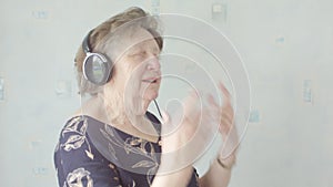 Senior woman listening to music on headphones