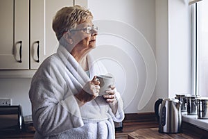 Senior Woman Looking out Window