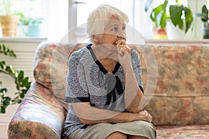 Senior woman lost in thought