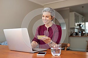 Senior woman making online payment