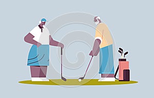 senior woman man couple playing golf aged african american family players taking a shot active old age