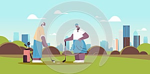 senior woman man couple playing golf aged african american family players taking a shot active old age