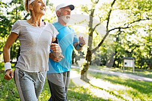 Senior woman and man running doing fitness exercises