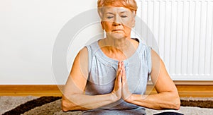 Senior woman while meditating