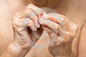 Senior woman nibbling nails, Body language feeling