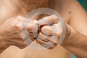 Senior woman nibbling nails, Body language feeling