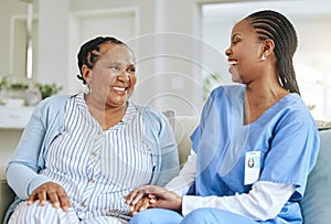 Senior woman, nurse and laughing together for support, healthcare and happiness at retirement home. Black person or