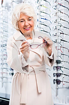 Senior woman in optical shop