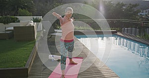Senior woman outdoor yoga fitness