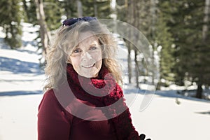 Senior woman outside in snow