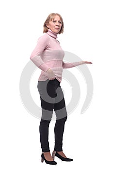 A senior woman - over sixty years old standing on white background