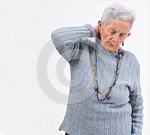 Senior woman pain on nape on white background