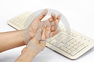 Senior woman painful finger cause use of keyboard