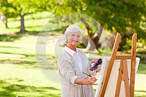 Senior woman painting