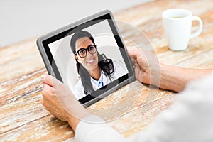 Senior woman patient having video call with doctor