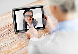 Senior woman patient having video call with doctor