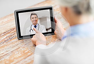 Senior woman patient having video call with doctor