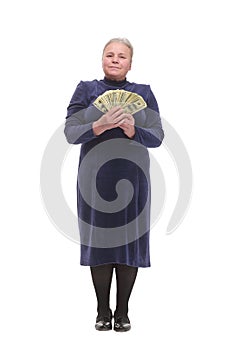 Senior woman pensioner holding money dollar bills in hand isolated white background. Positive emotion facial expression