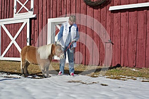 Senior Woman Petting Miniature Horse