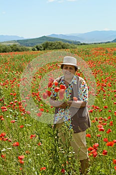 Senior woman picking flowers