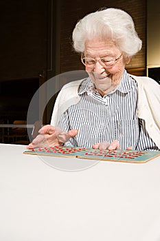 Senior woman playing bingo