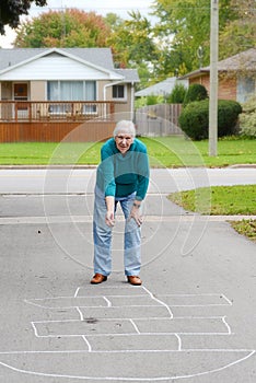 Senior woman playing child's game