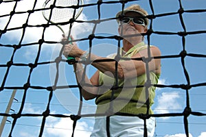 Senior woman playing tennis