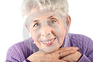 Senior woman portrait with hands under chin