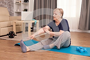 Senior woman practicing fitness at home