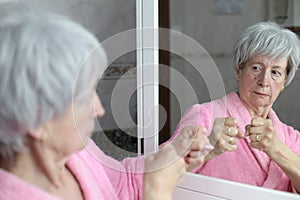 Senior woman preparing herself for a confrontation