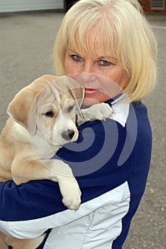 Senior woman with puppy