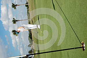 Senior woman putting